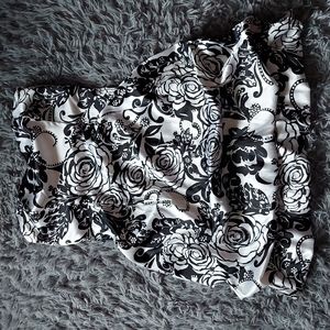 A Sequin Hearts, size 11 black and white rose and leaf designed strapless dress.